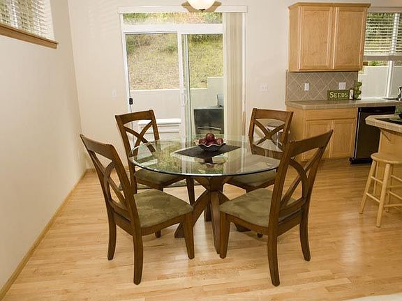 Casual dining area with sliding glass door leading to the back patio.