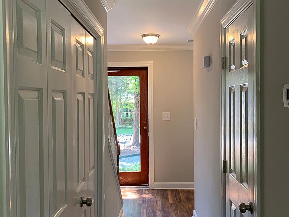 1st Floor- Hallway w. Access to half bath + laundry