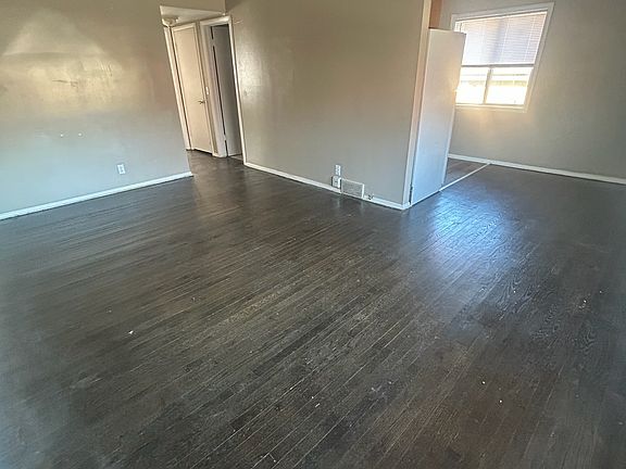 View from Entry Door looking at Living Room, Dining Room and Kitchen