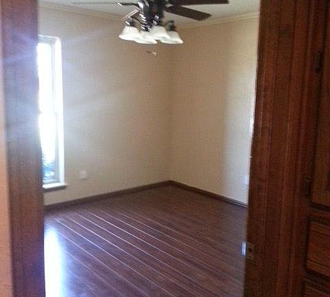 Bedroom 3. Laminate wood floors