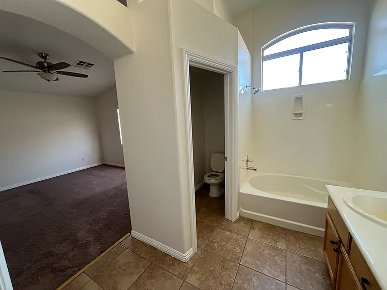 Primary bedroom and bathroom