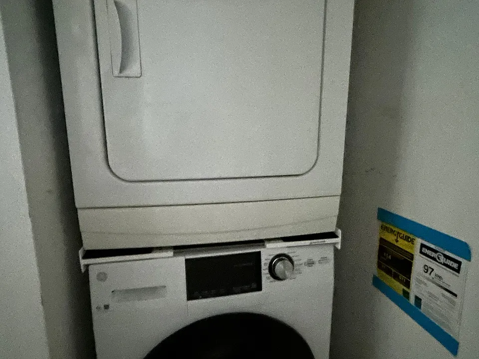 Washer & dryer are located in the corner of the kitchen
