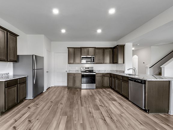Spacious, open kitchen with granite countertops