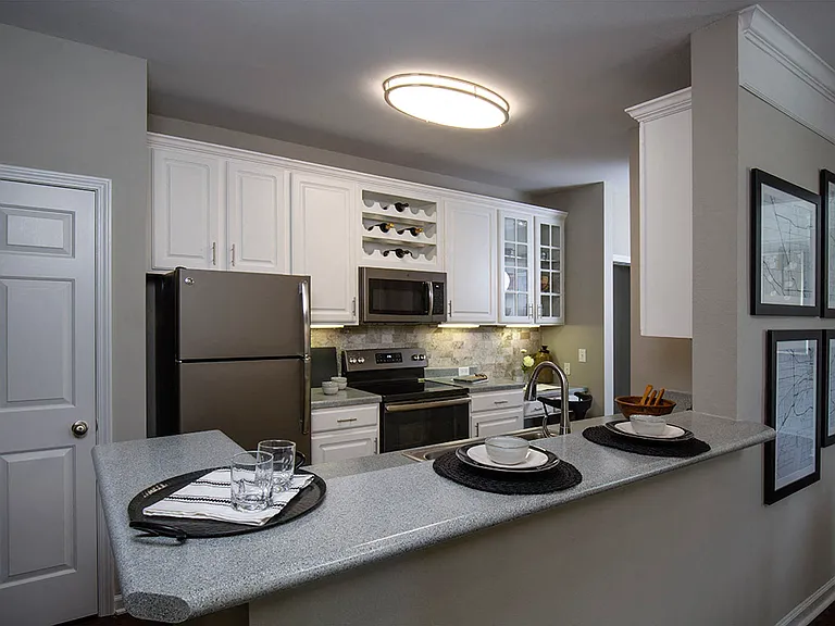 Kitchen with slate appliances and breakfast nook