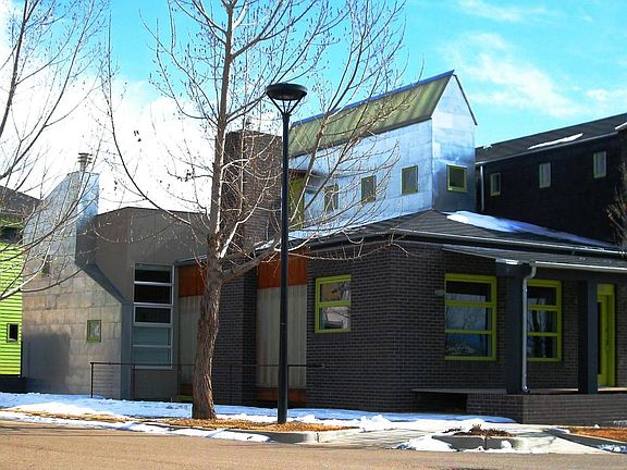 Corner panorama including garage/carriage house