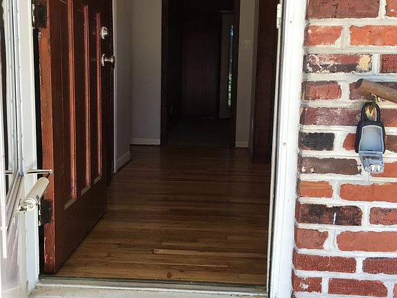 Door to foyer. Mostly hardwood floors throughout