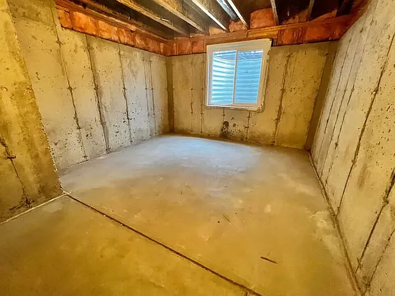 View of the portion of the basement beneath the foyer and office.