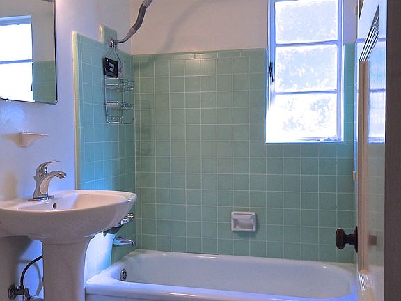 Bath - Original tile surround, pedestal sink, & complimentin
