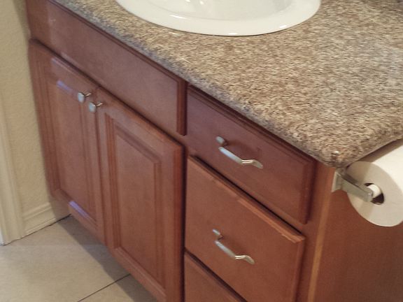 Bathroom w/ top mount sink and granite countertops