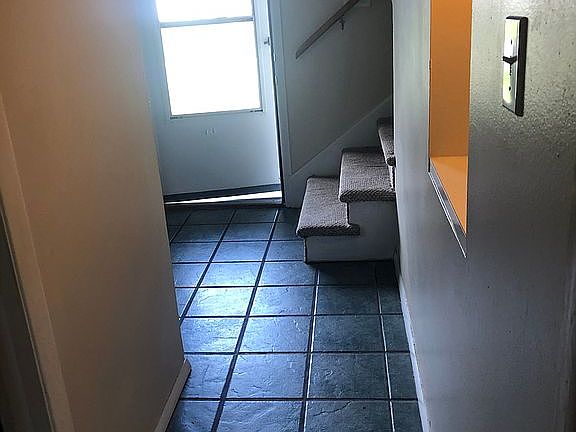 Hall to 1/2 bath & kitchen