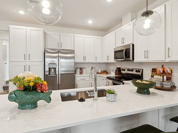 Kitchen with pendant lights over island