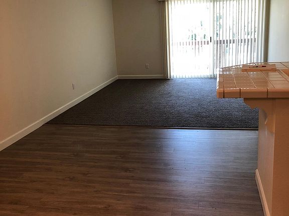 Dining room and living room, with balcony! New flooring.