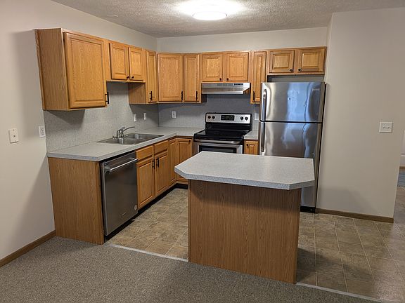 Kitchen with refrigerator, stove and dishwasher