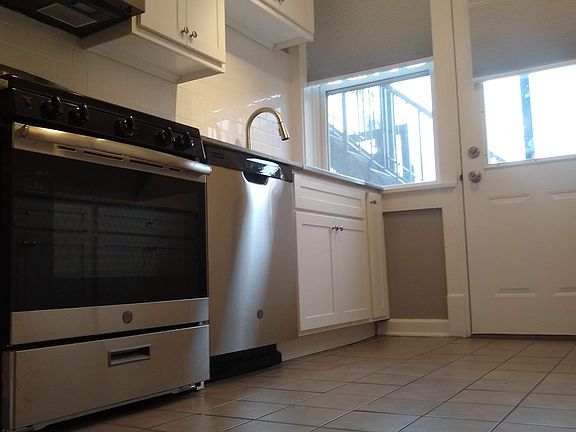 Door leads to off-street parking lot.