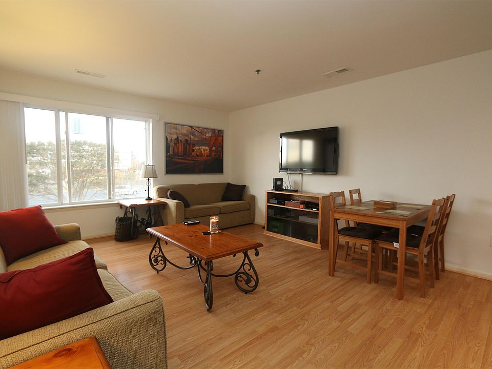 Living room, hard wood floors throughout , flat screen tv