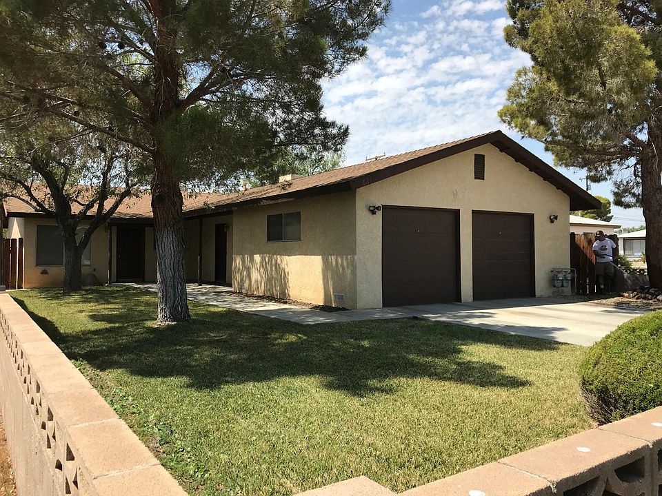 Block wall front fence. Apt B garage is door on the right.