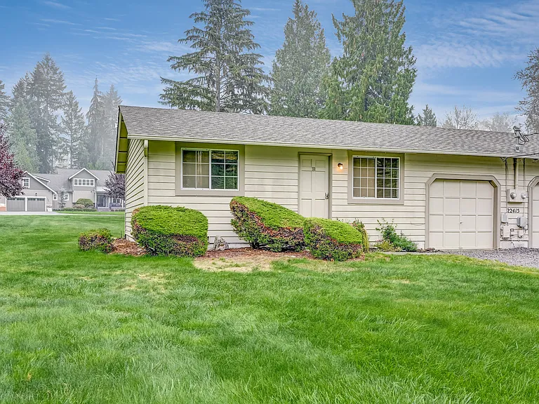 Rambler style Duplex with Garages in the middle for Privacy.