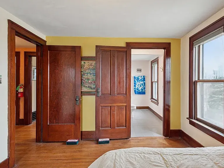 second floor queen bed with attached bathroom