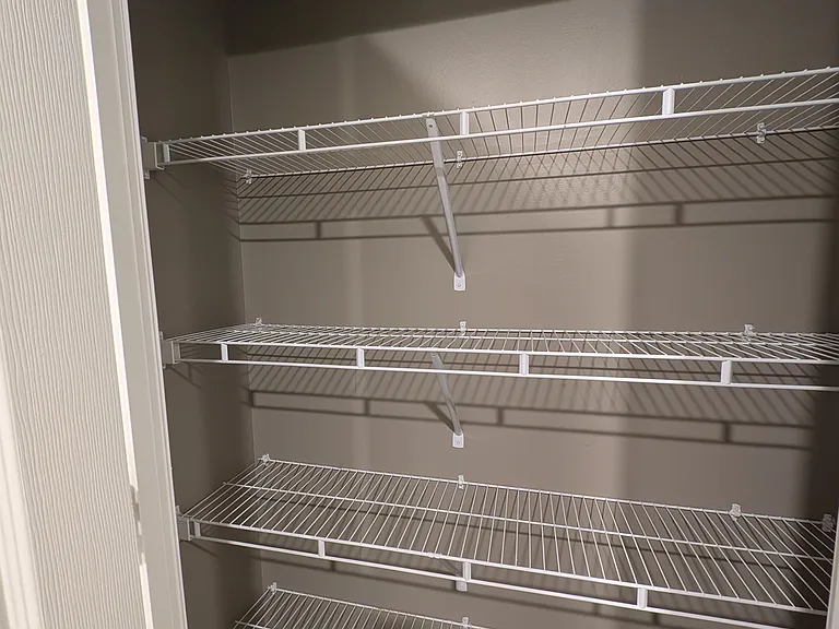 linen closet in master bathroom