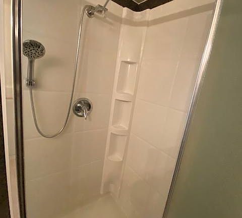 There is a hand-held, rain-cam shower.