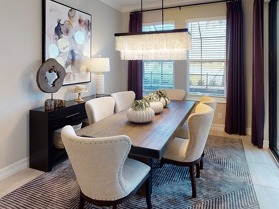 Seamlessly joining with the kitchen and lanai, the dining room makes it simple to host gatherings or