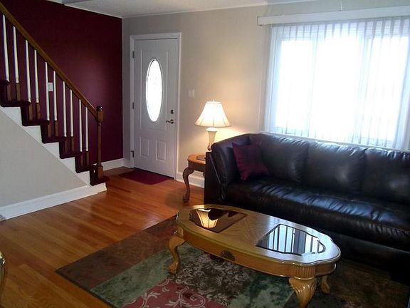 Entrance Area for Living Room w/ Beautiful Staircase
