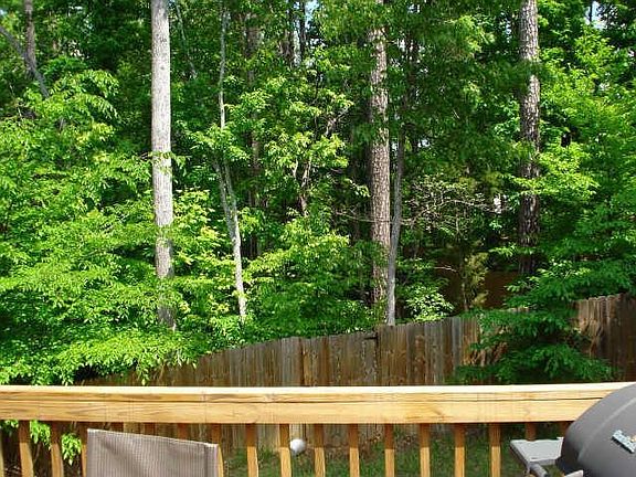 Breathtaking wooded view from fenced back yard