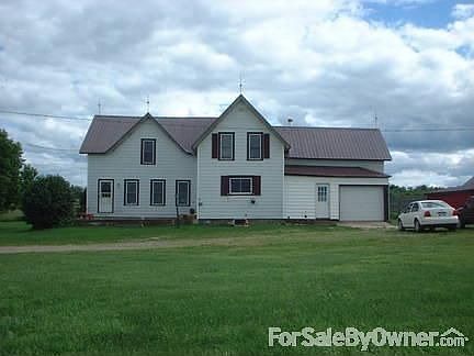 head on view of house : one car attached garage
