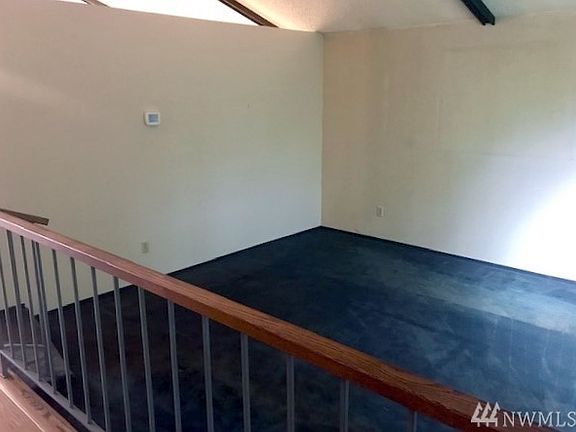 Here's another view of the living room. The vaulted ceilings also have exposed beams.