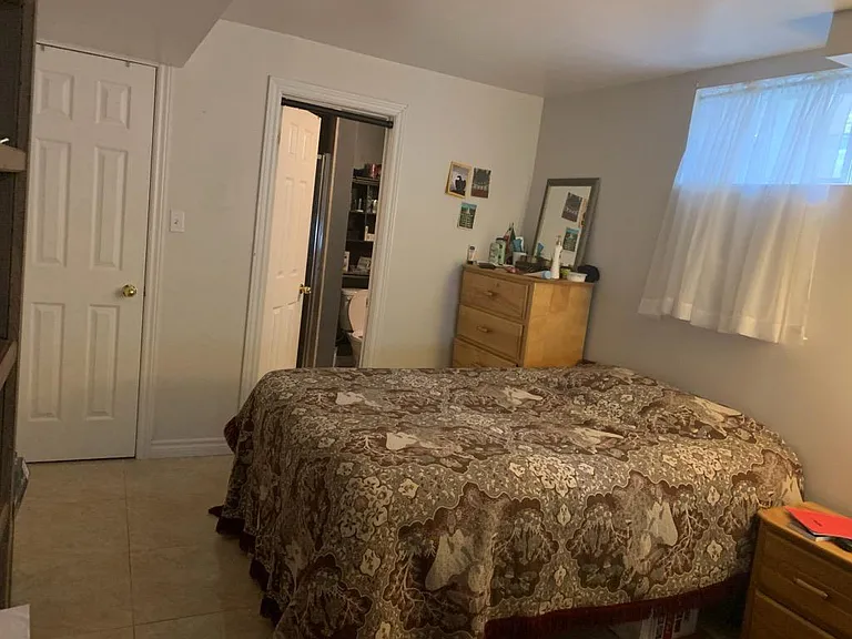 Large Bedroom 1 with pot lights, attached bathroom (3 piece), walk in closet and pot lights. Above ground windows with new blinds and high end ceramic floors for easy cleaning. The furniture is just to provide you an idea of space. The room is unfurnis