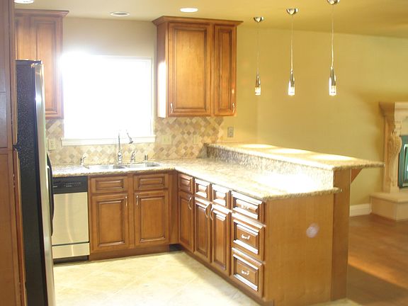 Another angle of the kitchen with the fireplace on the right.