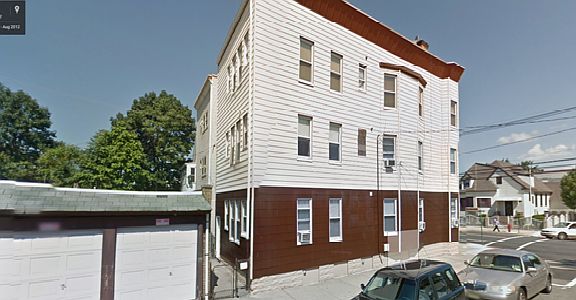 Side of house with parking garage