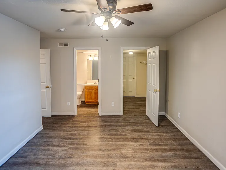 Primary bedroom with full bathroom and walk in closet