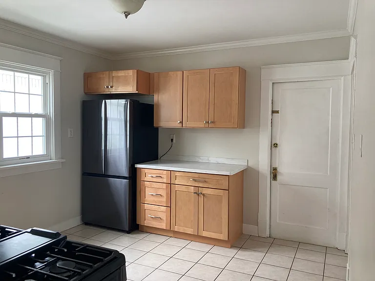 Renovated kitchen featuring french door refrigerator
