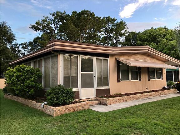 Front View .... left side is enclosed extra living space (sunroom).