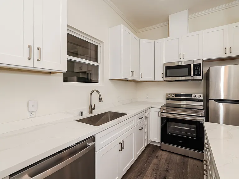 Fully remodeled kitchen with island and stainless appliances