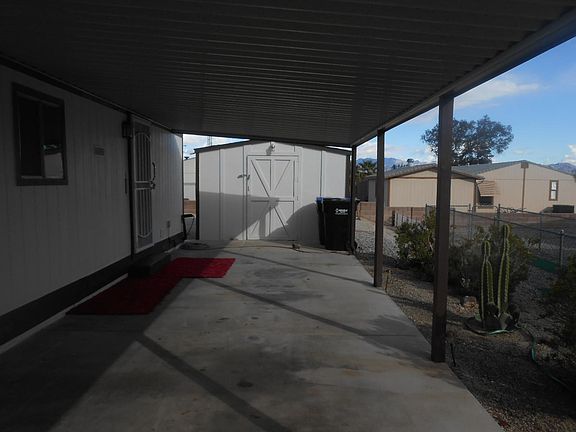 Carport with Large Shed