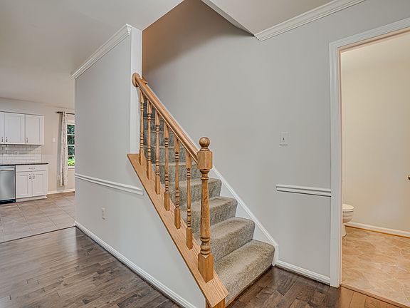 Entrance with powder room to right.