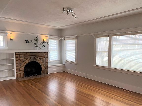 Living Room Pic#1: 13" x 23" Hunter Douglas blinds included. Red Oak hardwood floors.