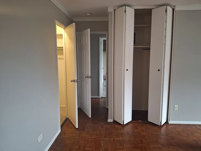 primary bedroom with view of walk-in closet and large second closet