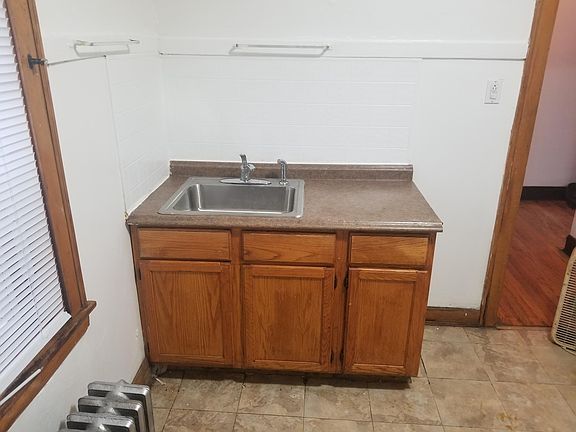Kitchen sink/cabinet with tile (sheet) backsplash