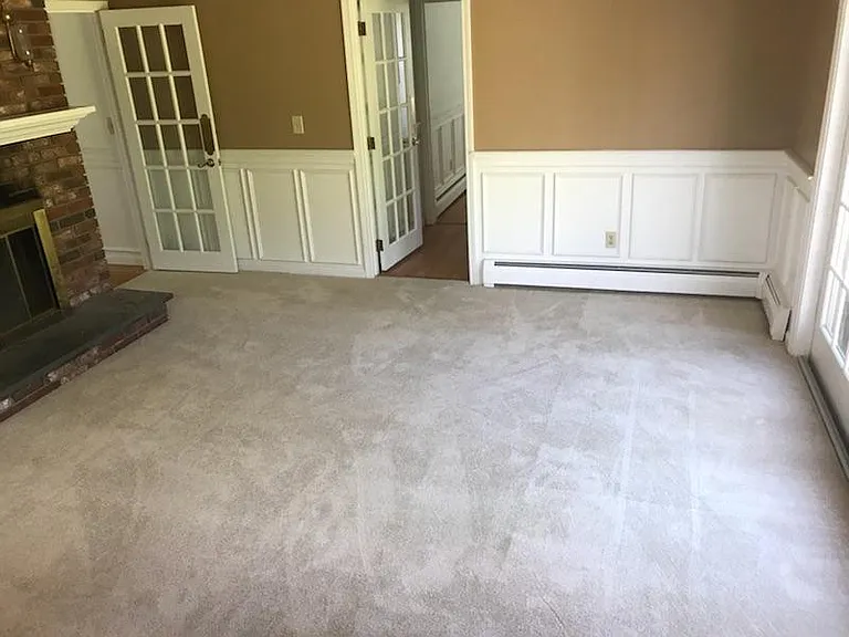 Carpeted den off of kitchen. Working fireplace. Slider to deck. Laundry/utility room is straight ahead