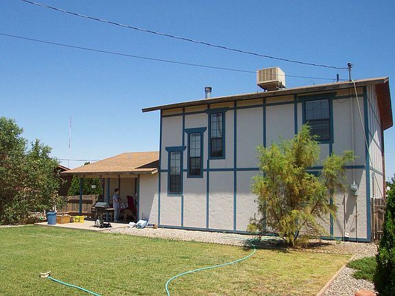 backside of house, grass has been removed for zero landscaping.