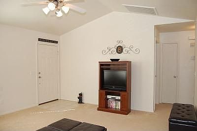 Open living area with raised ceiling