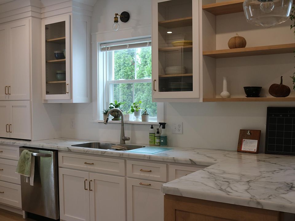 floating shelves, appliance garage, display shelving and stainless dishwasher