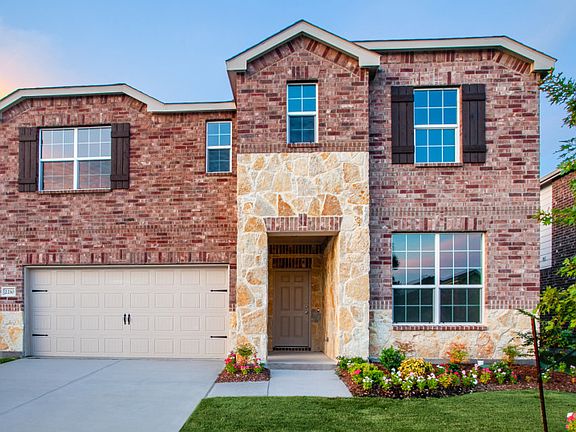 The Thomaston, a two-story home with shutters, shown with Home Exterior F