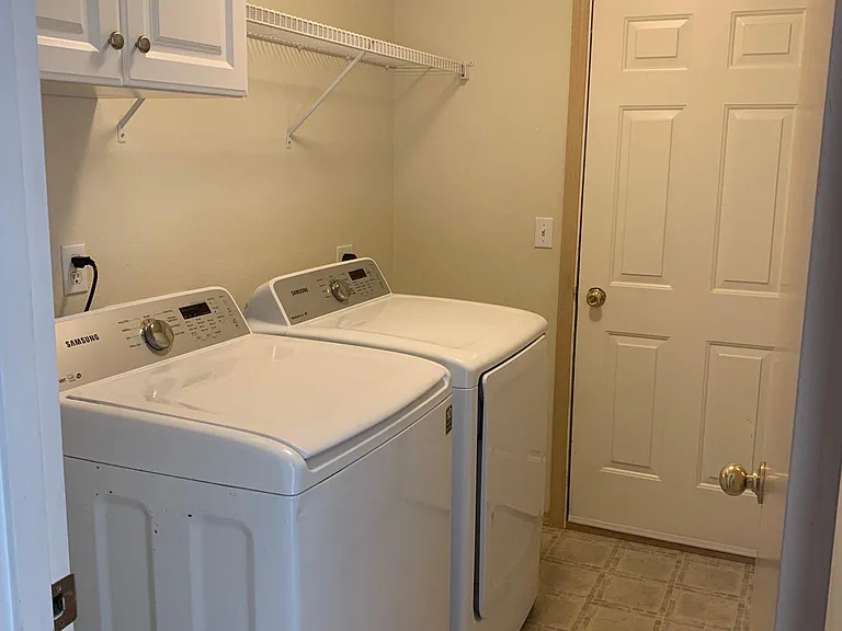 Laundry room with garage access. Washer and dryer included.