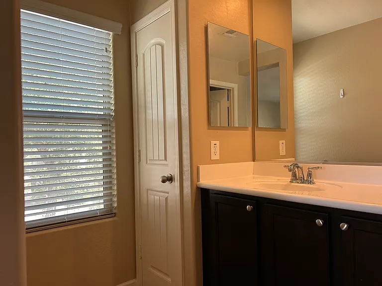 Primary bathroom with a side window