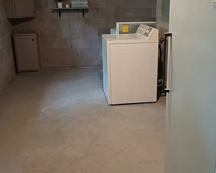 Garage includes washer and dryer and large freezer