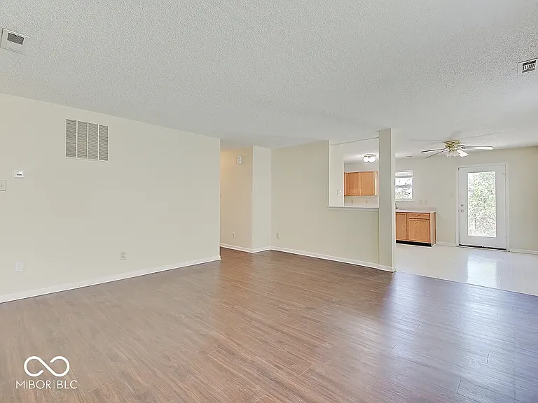 living room and kitchen view from entry